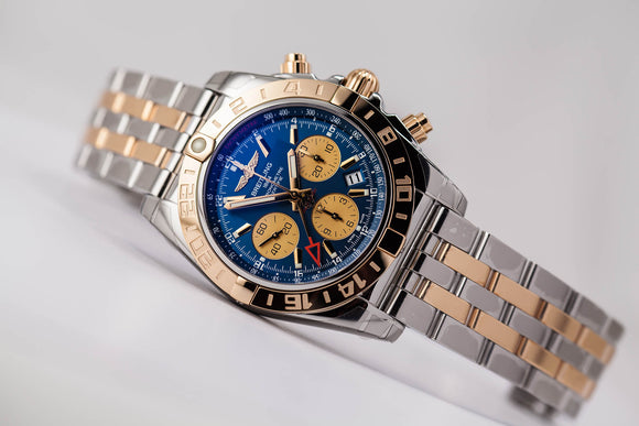 Factory refurbished Breitling Chronomat 44 GMT 18kt gold/SS Blue Dial with Extra Strap/Buckle - The Luxury Well
