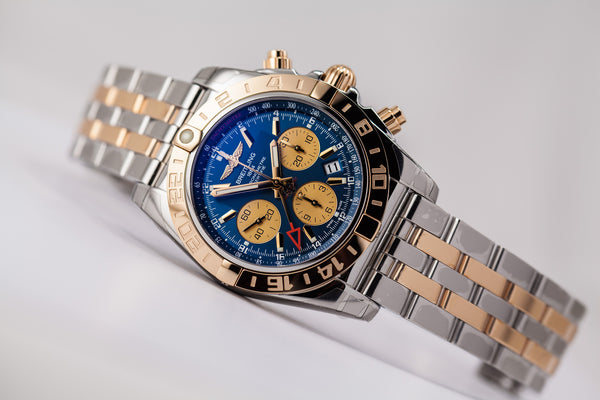 Breitling Chronomat 44 GMT 18kt gold/SS Blue Dial - The Luxury Well